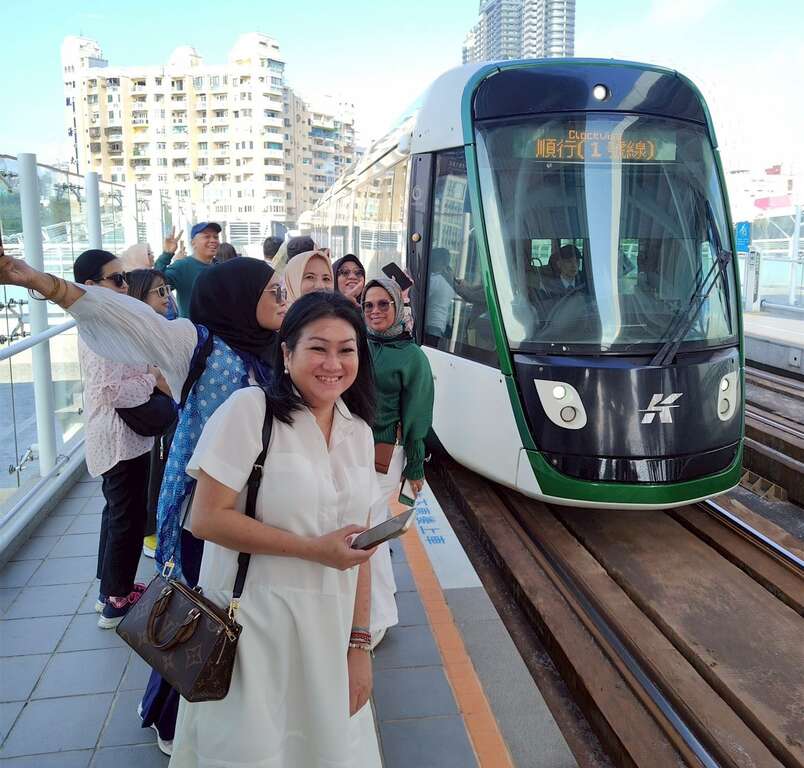 Figure 15. Indonesian familiarization tour group experiences riding the light rail.